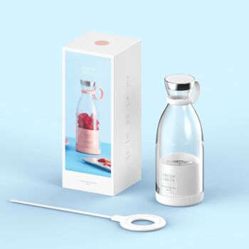 A White Fresh Juice Portable Blender, a charger for the blender which is also white, the Fresh Juice blender box which is white with a blue side showing the image of the blender, all in front of a blue background.